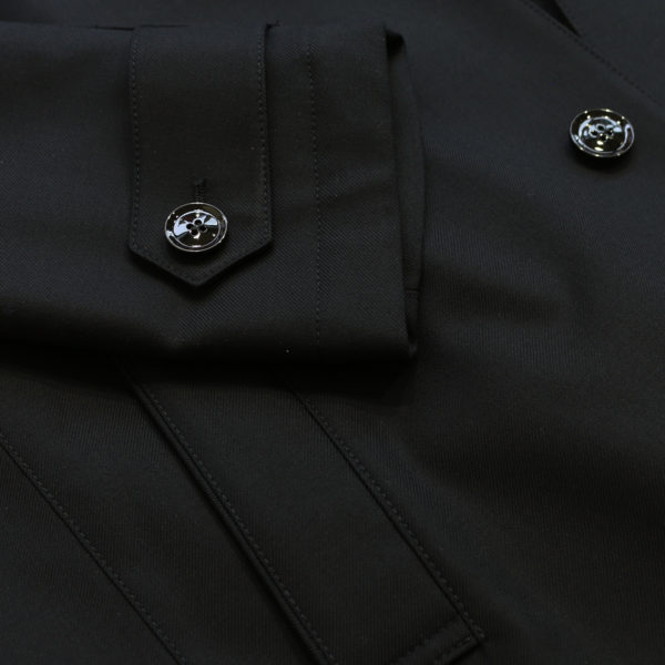 Eduard Dressler black raincoat sleeve detail